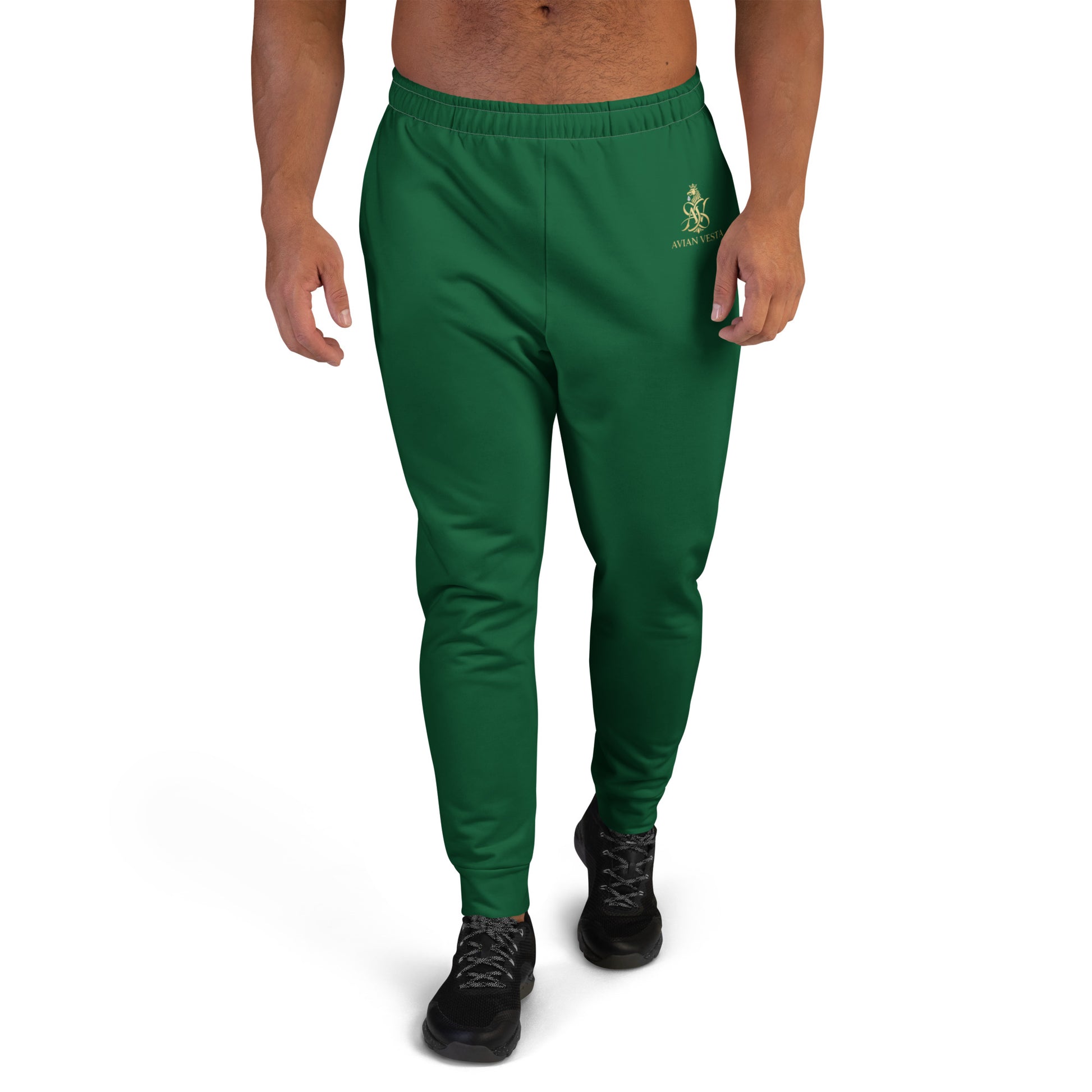 “Avian Vesta Signature Evergreen joggers with gold crest, front view, tapered fit.”