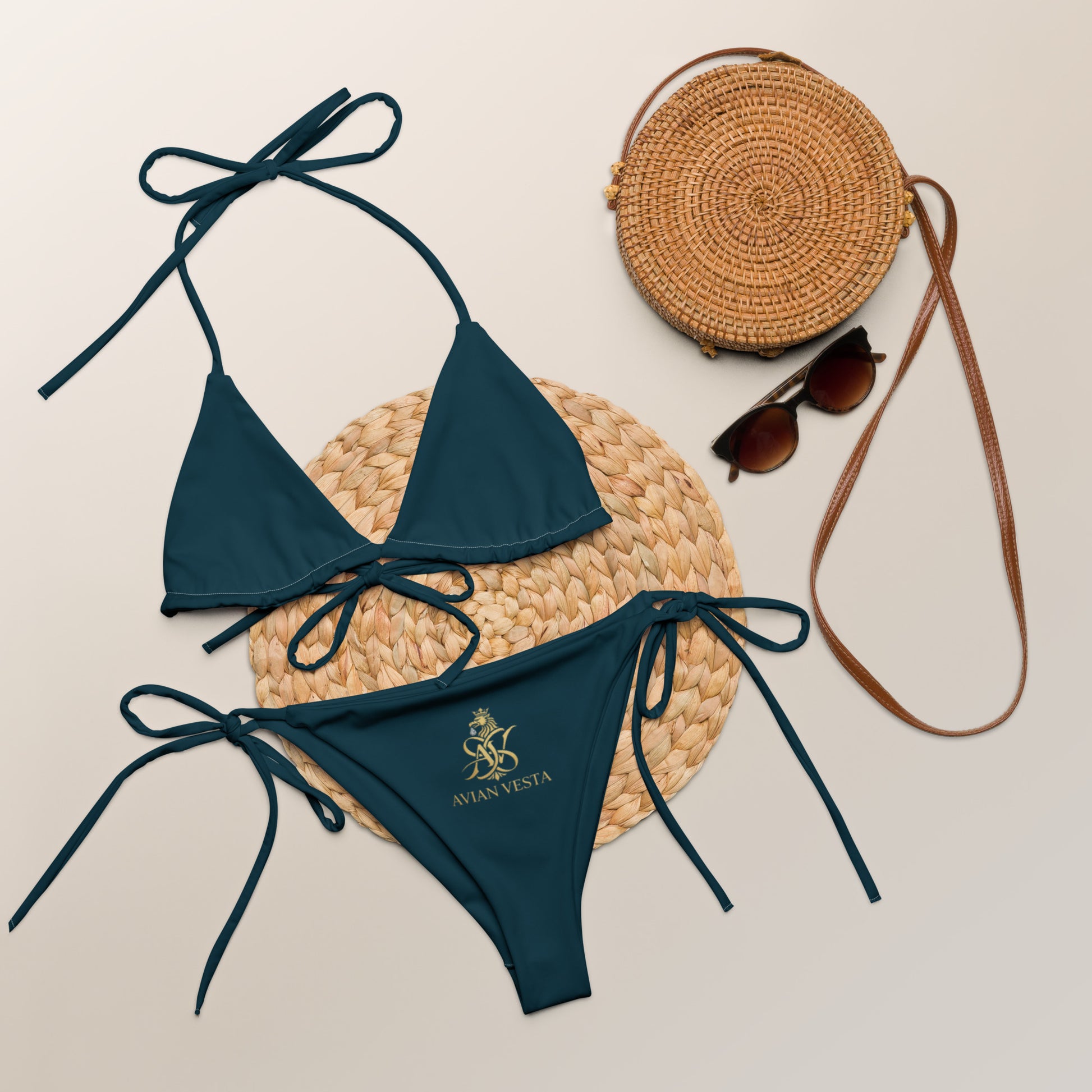 Blue Whale triangle bikini set styled with beach accessories and gold Avian Vesta crest
