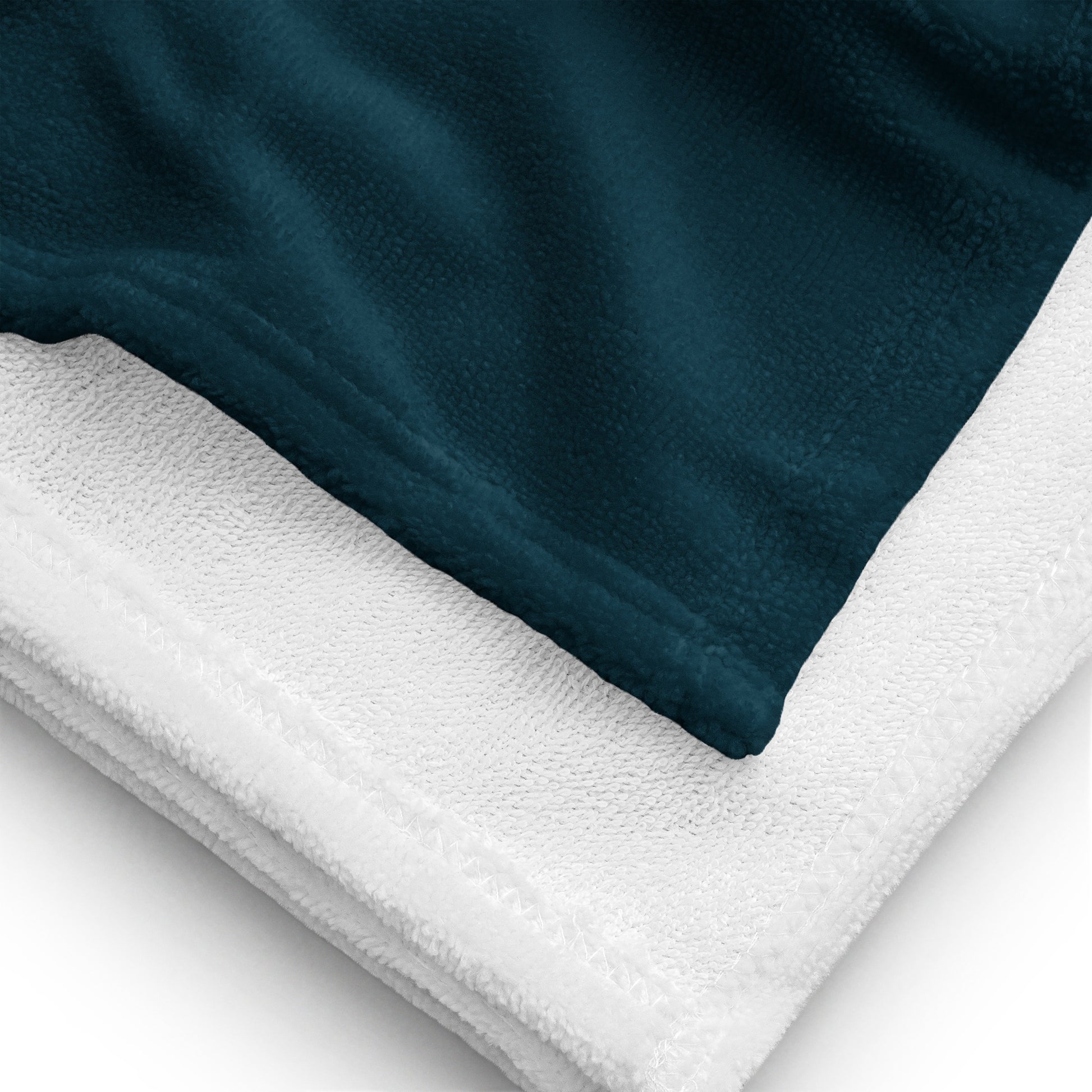 Close-up of Blue Whale luxury beach towel showing soft fabric and terry backing
